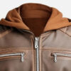 Close-up of detachable brown hood, front zipper and chest pockets on men's leather jacket